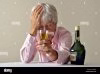liqueur-single-desperate-headache-drunk-sad-alcohol-senior-woman-drinking-BNJNK5.jpg